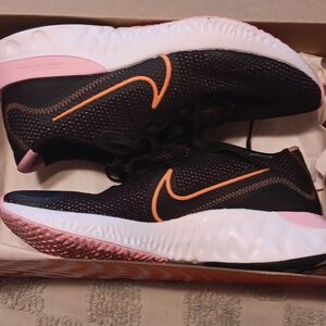 Nike "Renew"  size 9   womens running shoes. Navy blue pink and white sole